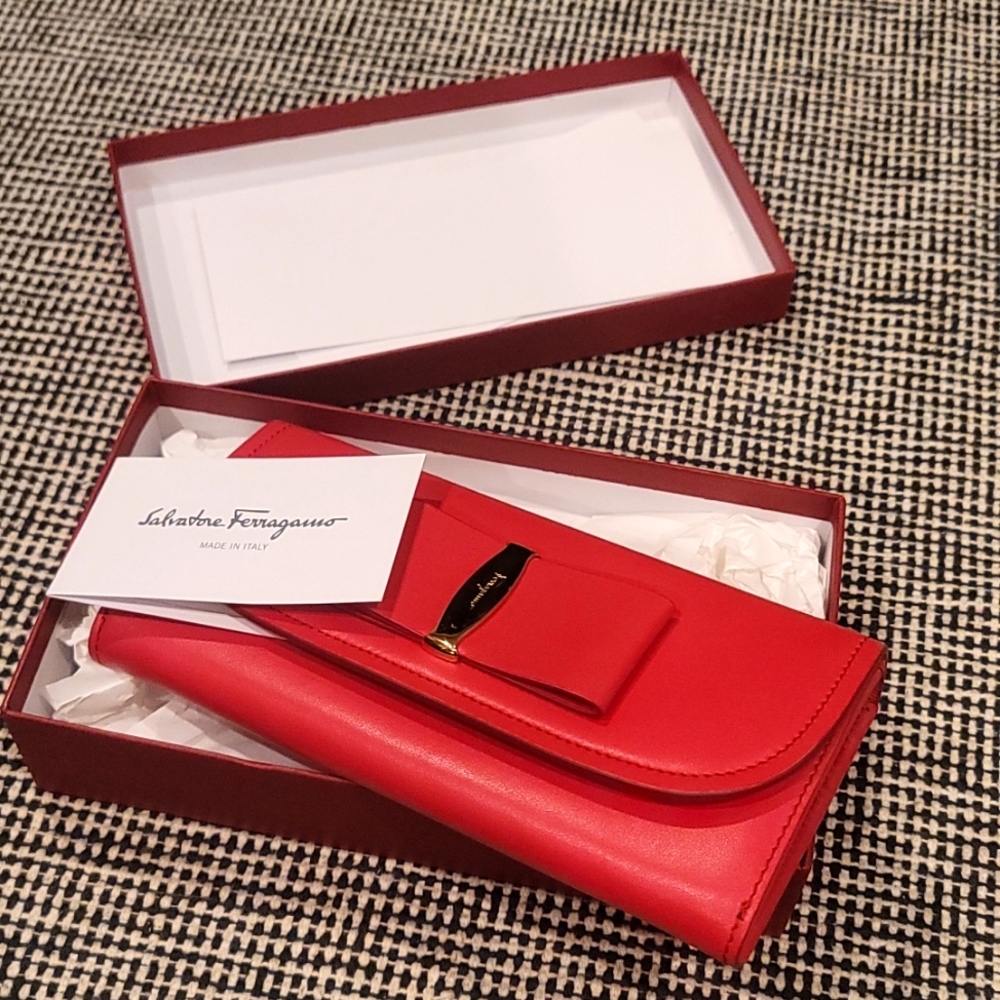 A red Salvatore Ferragamo wallet/clutch